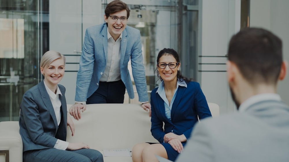 Team of business colleagues talking in a modern office